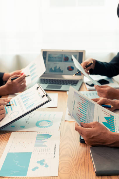 istock Planning data, annual reports, research and budgets in the office Company discussion with documents in strategy meeting Chart analysis vertical close-up image 2193542264
