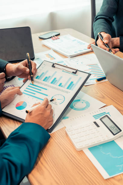 istock Planning data, annual reports, research and budgets in the office Company discussion with documents in strategy meeting Chart analysis vertical close-up image 2193542266
