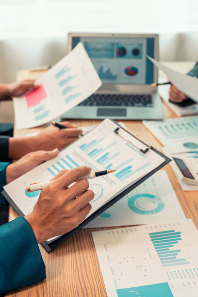 istock Planning data, annual reports, research and budgets in the office Company discussion with documents in strategy meeting Chart analysis vertical close-up image 2193542279