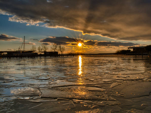 istock Wintersun Reflections on a Frozen Lake 2193543902