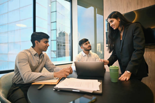 istock Team members discussing a project in a modern office during the afternoon 2193545491