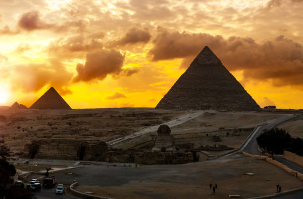 istock Giza pyramids and sphinx at sunset with dramatic sky 2193547467