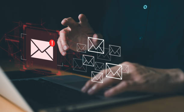 istock Business man using smartphone and computer that show warning sign after got attack phishing email by malware from hacker that commit cyber crime or software crash to cause an error. 2193549222