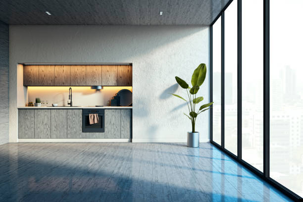 istock Modern empty kitchen with wooden cabinets, large windows, and indoor plant on a concrete wall and wooden floor background. 3D Rendering 2193550823
