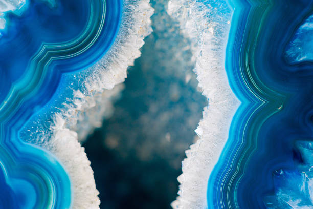 istock Close-Up of Vibrant Blue Geode Featuring Crystals and Layered Marble Formation 2193551460