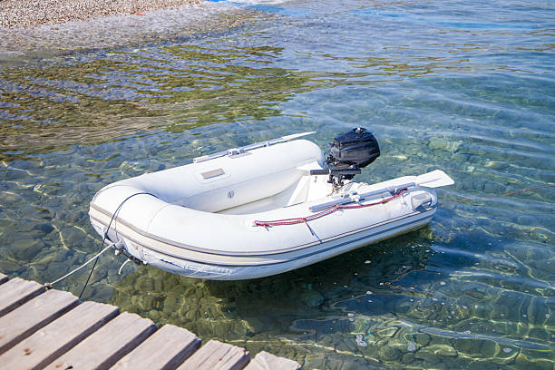 White inflatable boat on the water in the Mediterranean sea.
