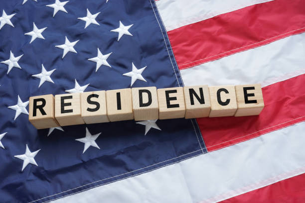 istock Permanent residence of USA is shown using the text and US flag 2193553046