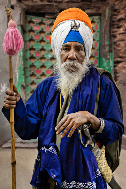 Amritsar, India - March 1, 2024: Sikh pilgrim in the Golden Temple in Amritsar, Punjab, India