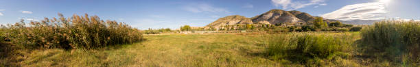 istock A breathtaking panoramic view of a stunning landscape with rolling hills and vibrant greenery 2193553919