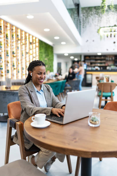 istock African woman working on laptop at cafe 2193556322