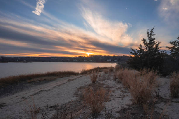 Sunset at Mt Sinai Harbor at Cedar Beach Town Park in Mt Sinai, Suffolk County,  Long Island  NY.