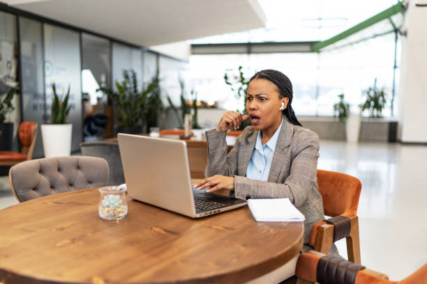 istock Frustrated businesswoman arguing with someone during a video call over computer 2193558388