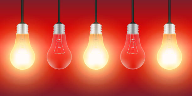 istock Light Bulbs with Glowing Lamps on Red Background. Decorative Light Bulbs for Christmas Background. 2193559911