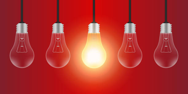 istock Light Bulbs with Glowing Lamps on Red Background. Decorative Light Bulbs for Christmas Background. 2193559920