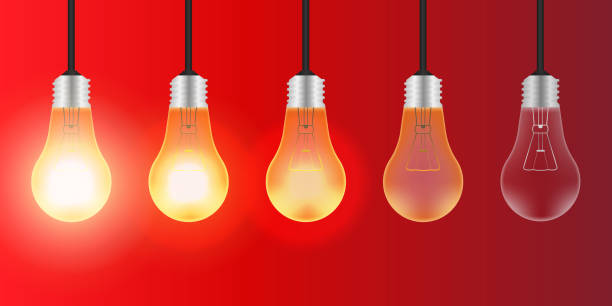 istock Light Bulbs with Glowing Lamps on Red Background. Decorative Light Bulbs for Christmas Background. 2193560026