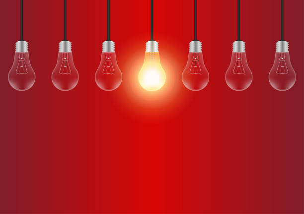 istock Light Bulbs with Glowing Lamps on Red Background. Decorative Light Bulbs for Christmas Background. 2193560784