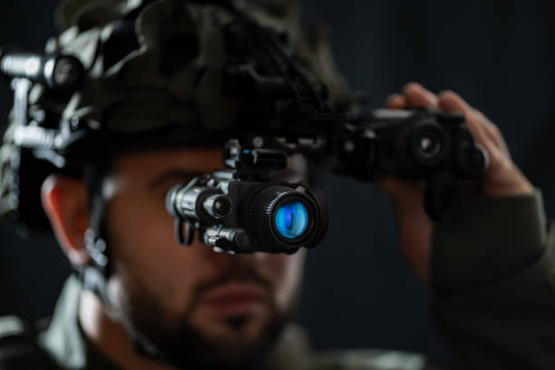 istock A modern warrior using night vision monocular and thermal imaging in the darkness. 2193566534