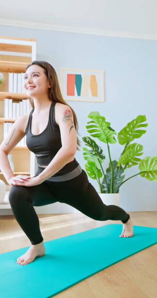 istock woman do lunge stretching exercise 2193566554