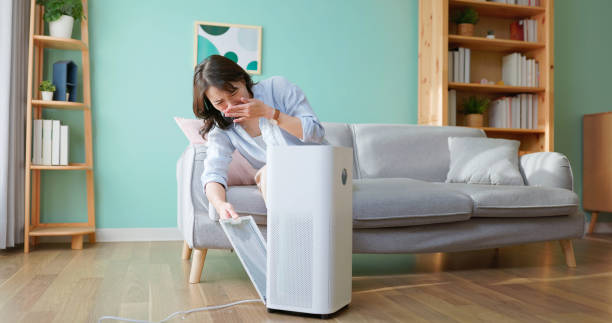 istock woman check dirty air purifier 2193566849