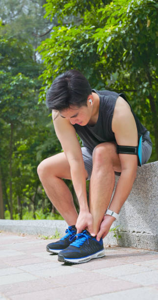 istock asian man sporting ankle injury 2193568357