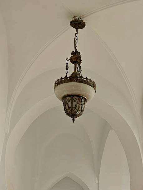 A copper chandelier hanging from the ceiling of the Dar Mustapha Pacha Palace, a historic building in the Kasbah of Algiers, Algeria