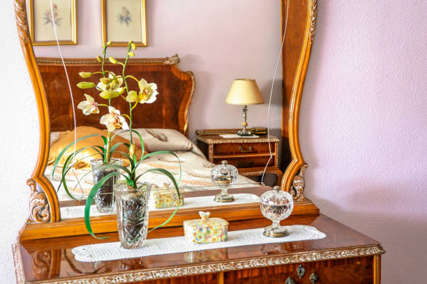 Yellow Sunflowers in Vase in Corner of Room Home Decor - Yellow artificial sunflower flowers interior design detail vignette.