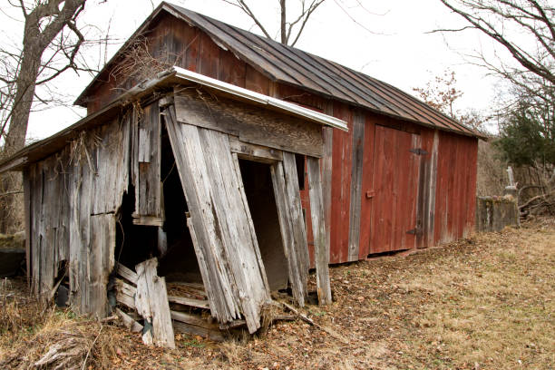Abandoned barn in disrepair crumbling
