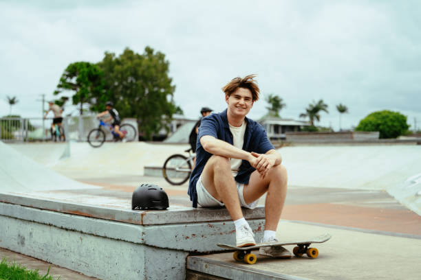 istock Young skateboarder resting at skate park after performing a tricks in a park, showcasing agility and outdoor adventure 2193578897