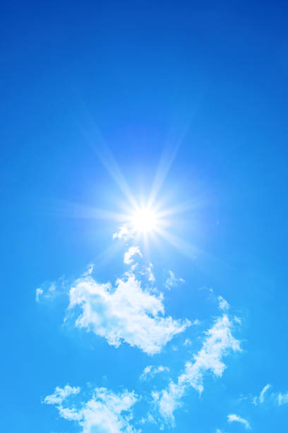 istock Bright sun with beautiful beams on a blue sky 2193578930