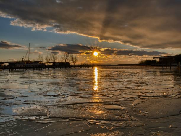 istock Sunset over Frozen Lake 2193579353