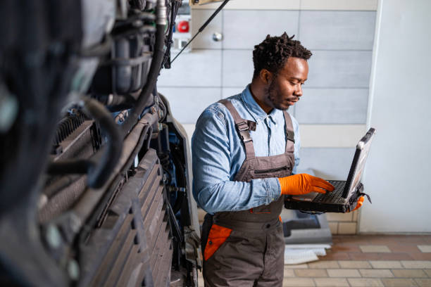 istock Truck mechanic trying to identify the problem. 2193579655