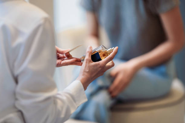 Close-Up of Hands Testing Fragrance in a Perfume Store