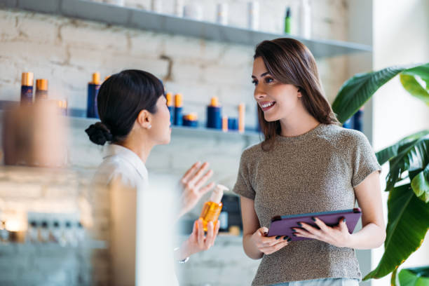 Women Discussing Skincare Products in Modern Retail Setting
