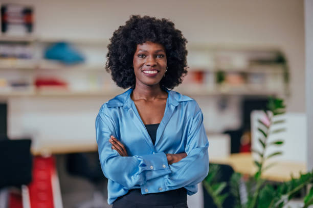 istock Confident Businesswoman Smiling in a Modern Office Environment 2193581143
