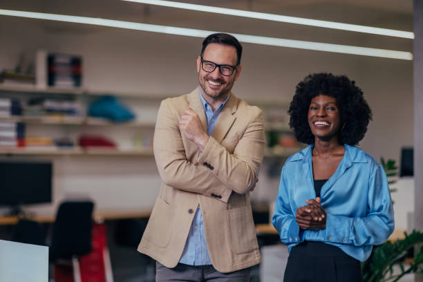 istock Business Team Smiling in Modern Office Environment with Confident Expression 2193581156