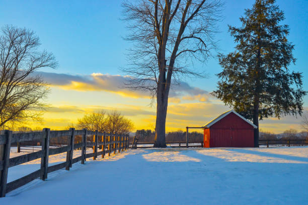 istock Snowy rural winter landscape with vibrant sunset 2193583609