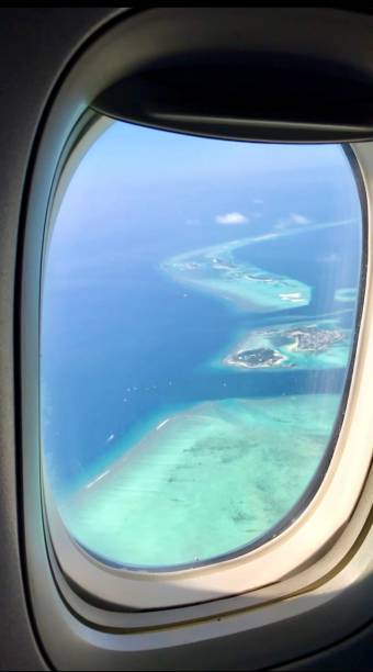istock Maldives atoll aerial view from airplane window 2193585387