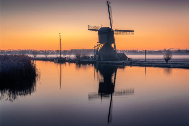 istock Golden Hour at Kinderdijk Windmill with Reflection, Netherlands 2193585519