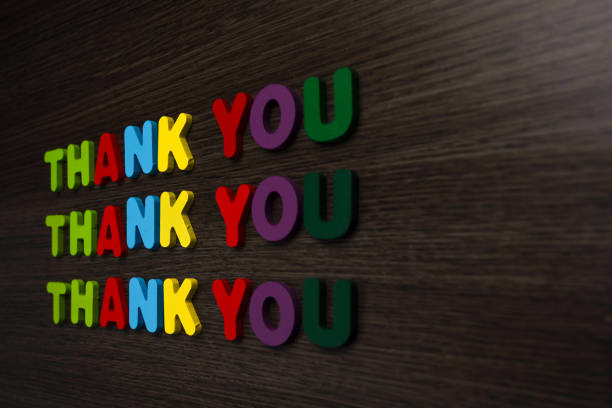 Repetitive Thank You Message on Wooden Background