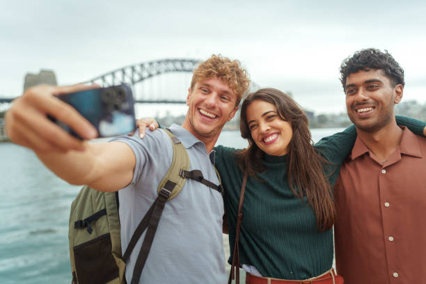 istock Three cheerful friends taking selfie with Sydney Harbour Bridge at the background 2193588536