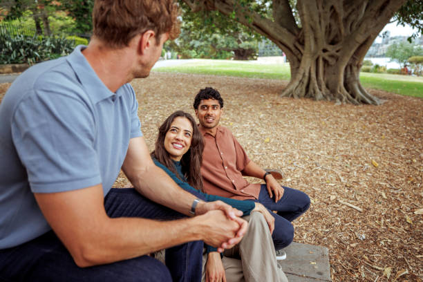 istock Three cheerful friends having fun at public park in Sydney 2193588651