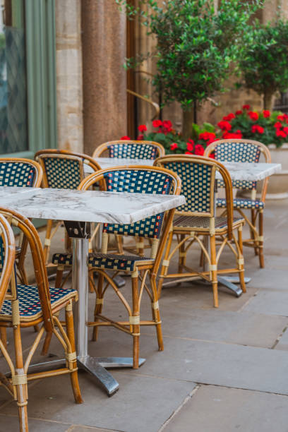 istock Empty tables and chairs outside a restaurant in oxford, england 2193590645