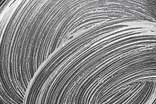 Lines of white foam. Detergent texture. Everyday cleaning routine in the kitchen.
