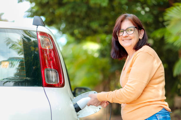 istock Charging an Electric Car Outdoors 2193591015