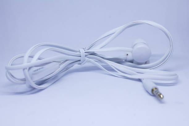 istock white wired headphones isolated on white background 2193591086