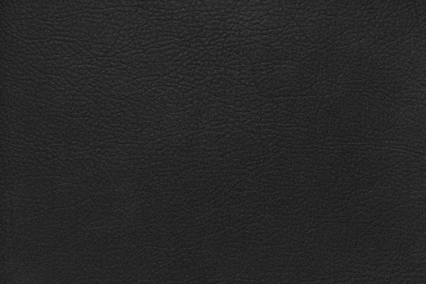 istock Natural, genuine solid black leather texture, structure of matte leatherette macro background 2193591286