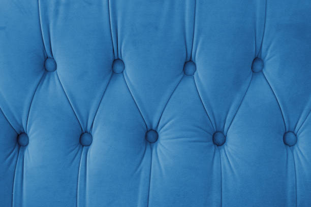 istock Capitone, Chesterfield style suede fabric texture, blue diamond buttoned blue background 2193591303
