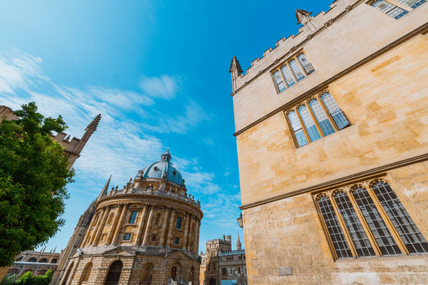 istock Radcliffe camera in oxford university with green tree and blue sky 2193591383