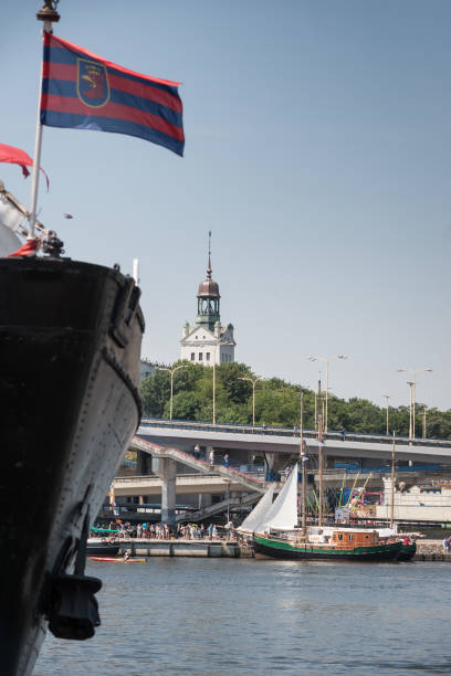 istock Szczecin Port Scene with Flag, Ships, and Bridge 2193592782
