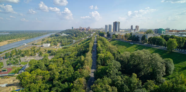 istock City with a river running through it and a green park 2193593694